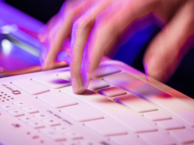 Close-up of fingers tapping FGDP pads