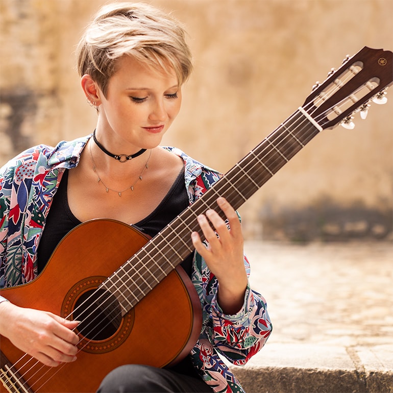 Women Playing CGX122MC Guitar