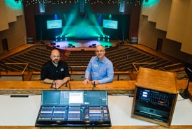 image showing Yamaha audio mixer in front of two people