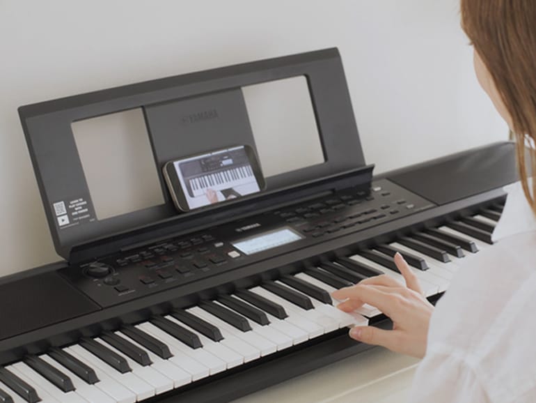 Woman practices Auto Chord Play.