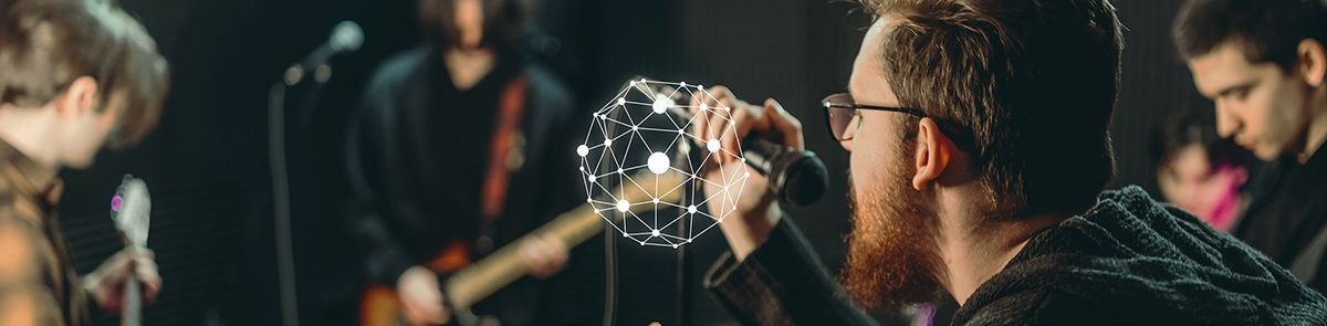 Image of a man singing a song while holding a mic