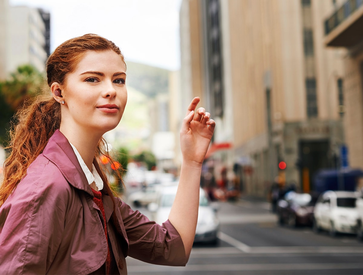 Image showing a female wearing red TW-E3C Wireless Earbuds