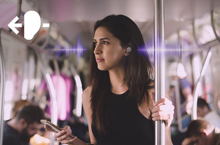 Image of a woman holding the phone wearing TW-E7B earbud 