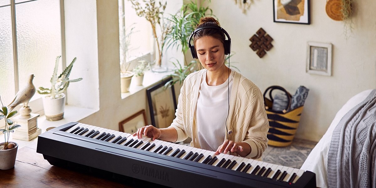 Women playing P-45 Piano