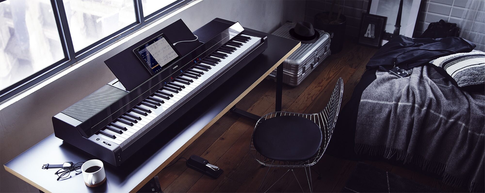 A Yamaha P-S500 Portable Digital Smart Piano on a desk