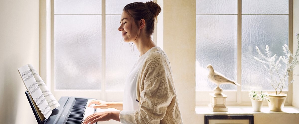 Women playing P-45 Piano