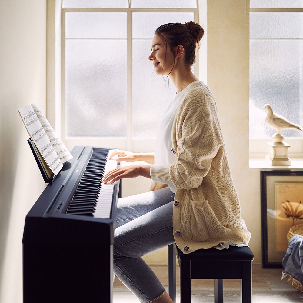 Women playing P-45 Piano