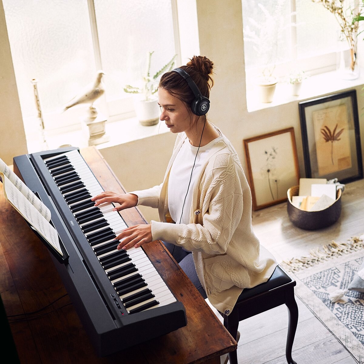 Women playing P-45 Piano Top View