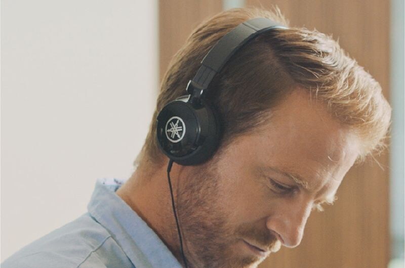 Man wearing Yamaha headphone