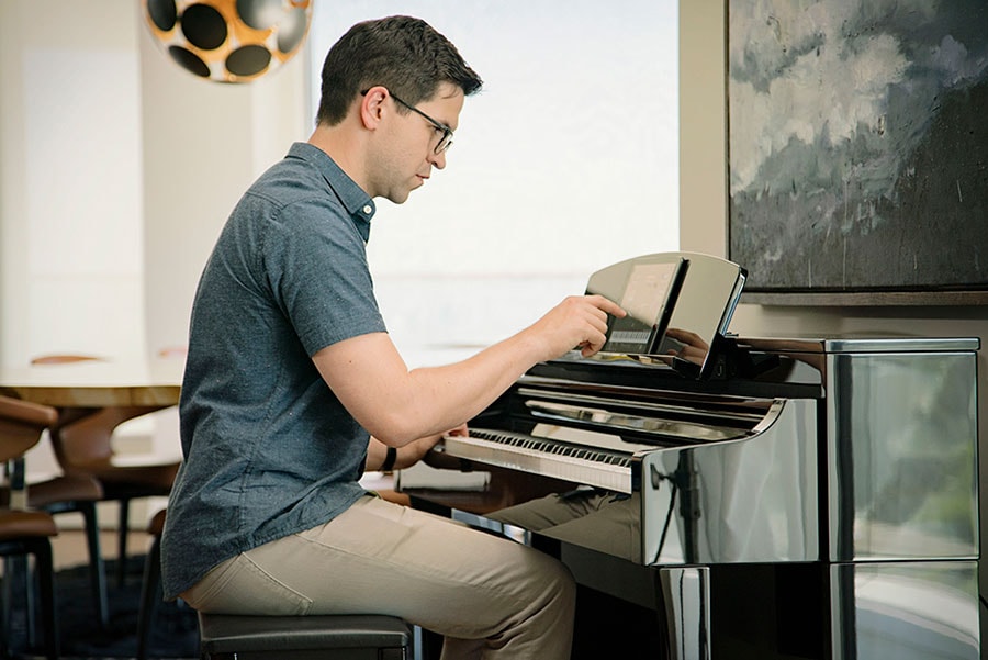 Man playing Yamaha Clavinova CSP Digital Piano